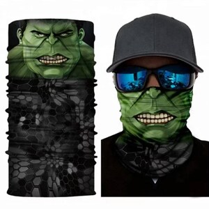 May include: A green and black face mask with a graphic of the Hulk's face. The mask is made of a stretchy fabric and can be worn as a neck gaiter, face mask, or headband.
