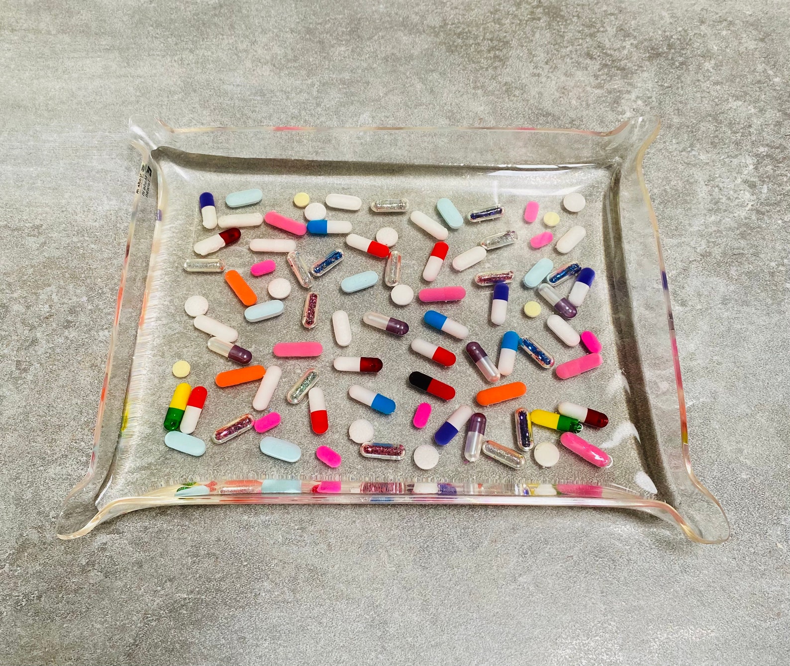 Lucite acrylic valet tray loaded with glitter filled pills and Etsy