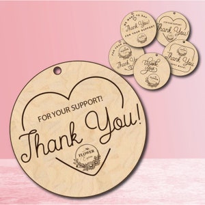 May include: A round wooden tag with a heart shape and the text "For your support! Thank You!" in a cursive font. The tag has a small logo with the text "The Flower Express" in a circle with a floral design.