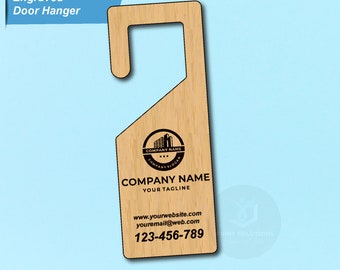 May include: A wooden door hanger with a company logo and contact information. The logo features a building with three stars and the text "COMPANY NAME" and "COMPANY SLOGAN". The text on the hanger reads "COMPANY NAME", "YOUR TAGLINE", "www.yourwebsite.com", "youremail@web.com", and "123-456-789".