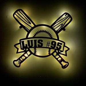 May include: A black baseball-themed light with two crossed bats, a baseball, and a banner with the name "LUIS #95".