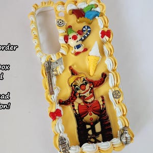 May include: A yellow and white phone case with a clown, ice cream cone, and other decorations. The case is made to order and is themed after Jackie's Box.