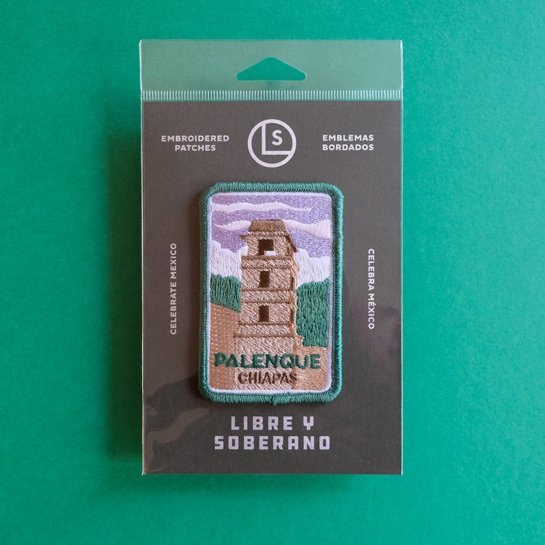 May include: An embroidered patch featuring a green and brown illustration of a Mayan temple with the text "Palenque Chiapas" and "Libre y Soberano" below. The patch is on a gray background with the text "Embroidered Patches" and "Celebrate Mexico" on the left and "Emblemas Bordados" and "Celebra M&eacute;xico" on the right.
