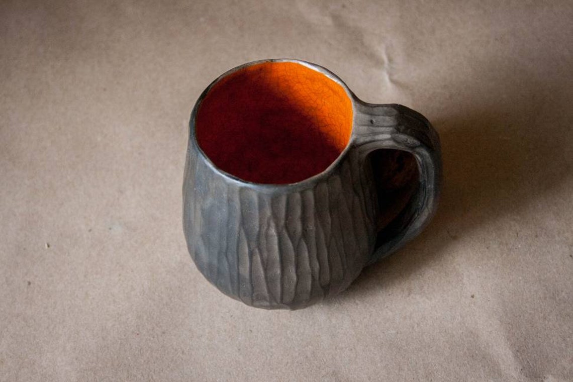 Raku pottery hand thrown black mug with carved texture Etsy