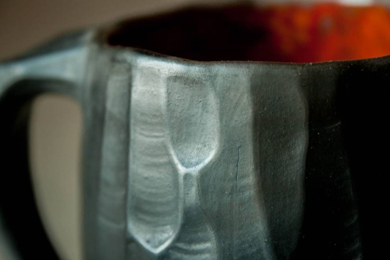 Raku pottery hand thrown black mug with carved texture | Etsy