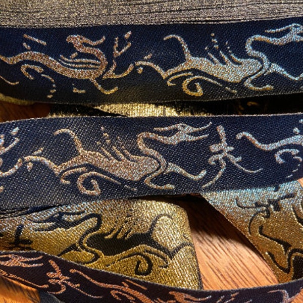 Black metallic gold dragon hydra jacquard woven fabric trim, 1 inch wide, sold by the yard.