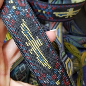 Thunderbird native jacquard woven fabric trim, 1 1/4 inch wide, sold by the yard.