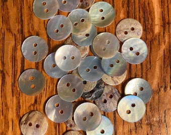 12 mother of pearl round buttons, 1/2 in. New or vintage. #242