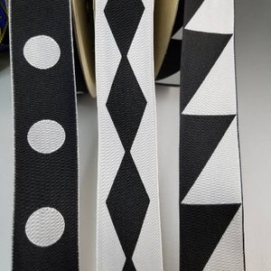 Black and white madness jacquard woven fabric trim, 1 1/4 inch wide, sold by the yard.