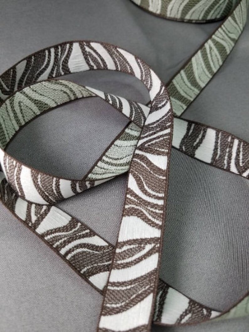 Sand readings 34 inch wide fabric trim sold by the yard. Scrapbooking