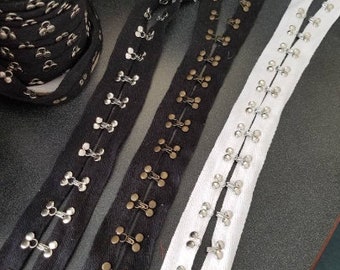 Chunky hook and eye tape fabric trim, spaced 1 inch apart, sold by the yard.