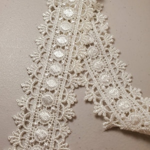 Venice lace galloon ivory 1 7/8, sold by the yard.