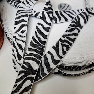 Wild zebra jacquard fabric trim, 1 1/8 inch wide, sold by the yard.