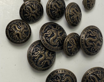 5 dragon antique tone  buttons in 3 sizes. #89