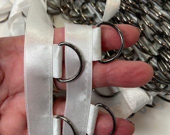 Satin lace up tape, 5/8 inch wide, large gunmetal rings, spaced 1 inch apart, sold by the yard.