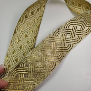 2 1/8” Gold Celtic knot jacquard woven trim, sold by the yard.