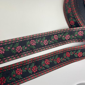 Folk Art, pink or red and green, 1 1/2 inch wide, jacquard woven fabric trim, sold by the yard.