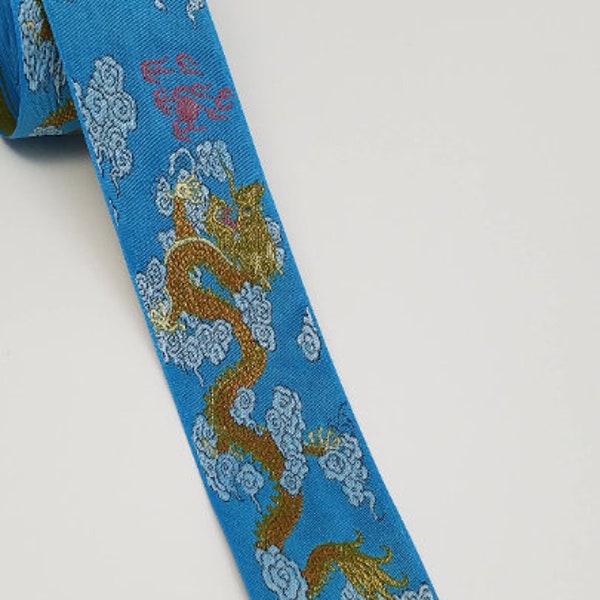 Blue and gold dragon jacquard woven fabric trim, 2 inches wide, sold by the yard.