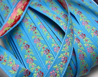 Darling delicate floral jacquard woven ribbon, 1/2 inch wide, sold by the yard.