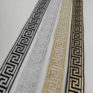 7/8 inch Greek key metallic ribbon trim, sold by the yard.