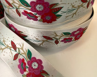 Floral, red and pink 1 3/8 inch wide, jacquard fabric trim, sold by the yard.