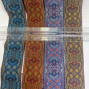 Eastern palace metallic, 2 inch wide jacquard woven fabric trim, sold by the yard.