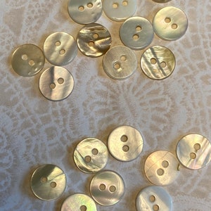10 mother of pearl buttons, in very good vintage or new condition. #51