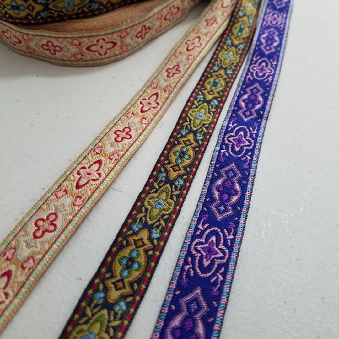 Deco design jacquard fabric trim, 2 inch wide, sold by the yard.