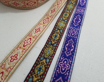 3/4 inch wide Mediterranean style woven fabric trim, sold by the yard.