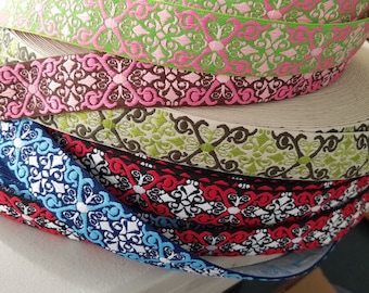 1” wide Celtic X scroll woven fabric trim, sold by the yard.