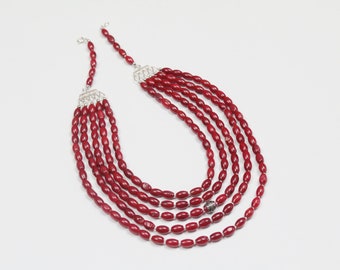 Bright red coral necklace on silver holders. Silver handmade details. Ukrainian traditional decoration. Ethno style for every day.