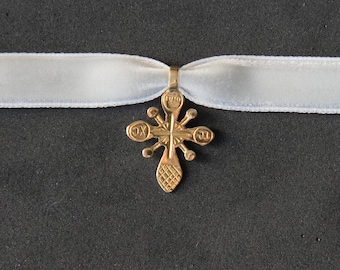 Body cross, a reduced copy of a &quot;ryasnyy&quot; or rich cross (a traditional Ukrainian jewelry).