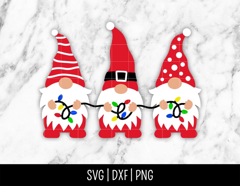 May include: Three red gnomes with white accents holding strings of colorful Christmas lights. The gnomes are wearing red hats with white stripes, white dots, and a black belt.