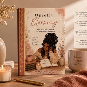 The journal standing upright next to a lit candle, a mug, a pen, and text callouts highlighting features.