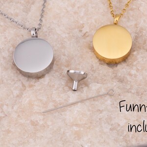 May include: Two silver and gold cremation necklaces with round pendants. A small funnel and a long, thin tool are included in the image. The text "Funnel Kit included" is visible in the image.