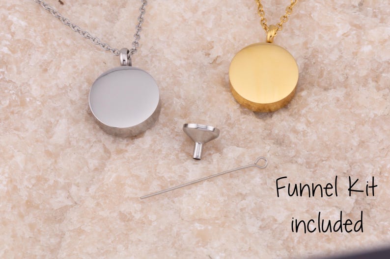 May include: Two silver and gold cremation necklaces with round pendants. A small funnel and a long, thin tool are included in the image. The text "Funnel Kit included" is visible in the image.