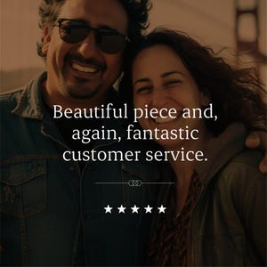 May include: A testimonial graphic featuring two smiling individuals, one wearing dark sunglasses and a denim jacket. The text reads: Beautiful piece and, again, fantastic customer service. Below the text are five white stars and a decorative line.