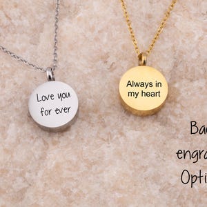 May include: Two silver necklaces with round pendants. The pendant on the left says "Love you for ever". The pendant on the right says "Always in my heart".