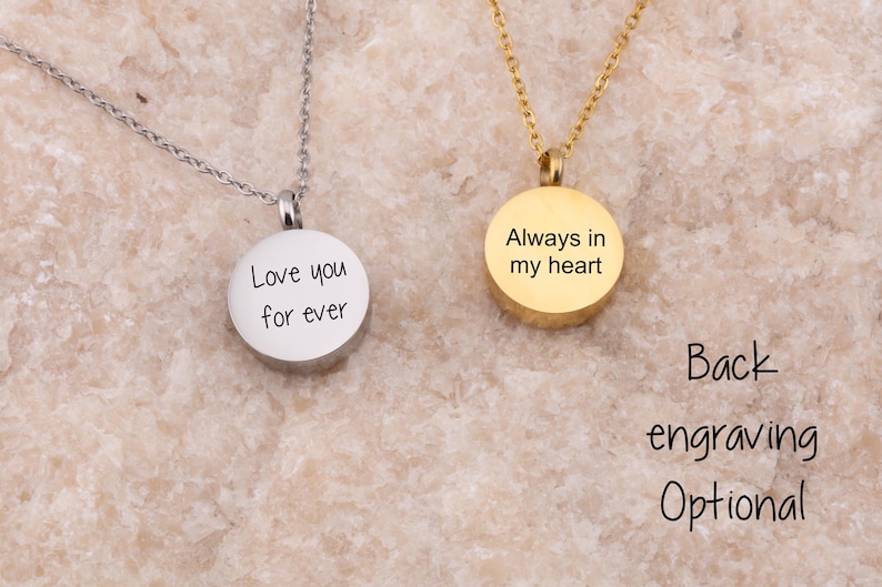 May include: Two silver necklaces with round pendants. The pendant on the left says "Love you for ever". The pendant on the right says "Always in my heart".