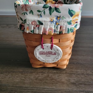 Vintage Tall Square Longaberger Basket marked 1997, with Ceramic Tie marked Dresden and flowered liner