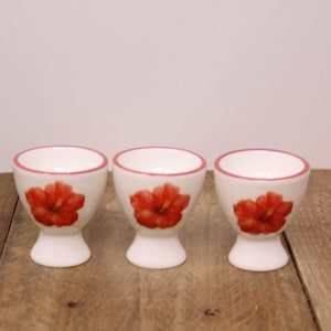 3 White Porcelain Egg Cups with Red Flower Design
