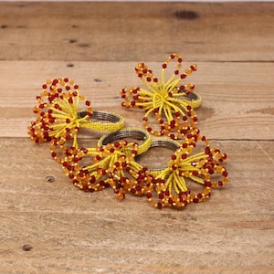 4 Yellow, Orange and Red Beaded Napkin Rings