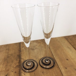 Set of Tall Champagne Flutes with Retro Black Swirl Base