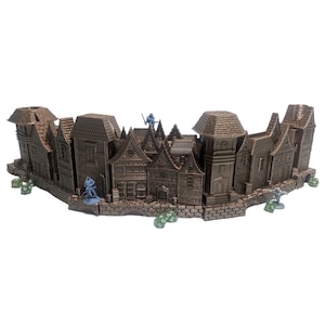 May include: A brown, 3D printed, medieval town set with multiple buildings, including a clock tower, and a stone wall. The set is designed for tabletop gaming.