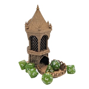 May include: A brown 3D printed tower with a pointed roof and a window. The tower is open on one side and has green dice rolling out of it. The dice are numbered 1-6 and 8-20.
