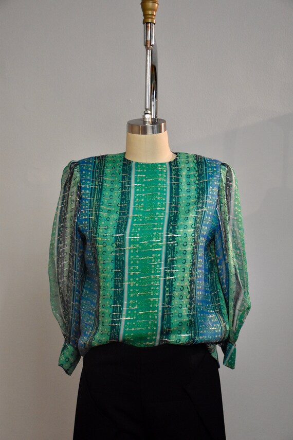 Vintage green silk blouse from the 70s