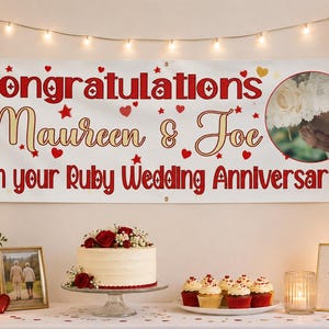 May include: A white horizontal banner with red text reading Congratulations Maureen & Joe On your Ruby Wedding Anniversary, featuring red and gold heart and star accents and a circular photograph of a bouquet of white flowers.