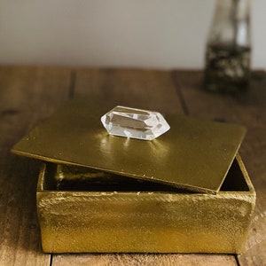 Gold trinket and jewellery box with double terminated polished quartz crystal handle