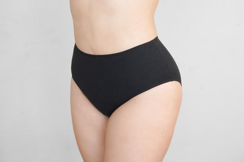 May include: Black high-waisted underwear with a smooth, seamless design.
