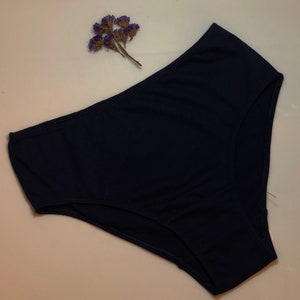 May include: A dark blue pair of underwear made of a soft, stretchy fabric.